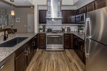 Kitchen with appliances and wooden cabinet